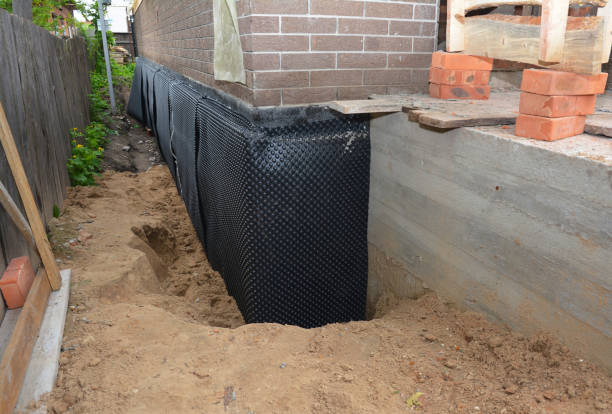 Happy homeowners after waterproofing job in Landing